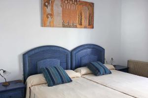 Posteľ alebo postele v izbe v ubytovaní Apartamentos El Minarete + 34 fotografií