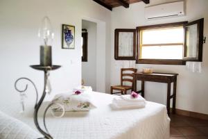 Postel nebo postele na pokoji v ubytování Agriturismo la Gioia + 33 fotografií
