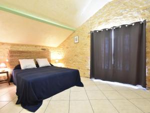 Krevet ili kreveti u jedinici u objektu Stone house with shared pool near Sarlat