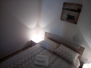 Postel nebo postele na pokoji v ubytování Apartman Pajo