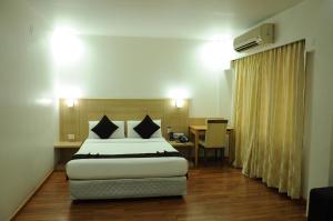 Postel nebo postele na pokoji v ubytování Hotel Ambient Turret + 33 fotografií