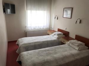 Postel nebo postele na pokoji v ubytování Hommiku Guesthouse