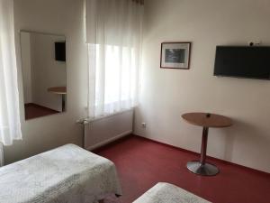 Postel nebo postele na pokoji v ubytování Hommiku Guesthouse