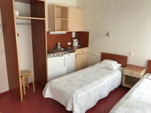 Postel nebo postele na pokoji v ubytování Hommiku Guesthouse