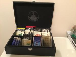 a black box filled with different types ofddsermottermottermott at Ingleneuk Bed and Breakfast in Edinburgh