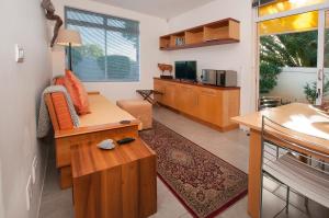 a living room with a couch and a table at Palamos on Sea in St Francis Bay