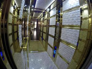 a hallway in a building with a glass door at Business Hotel Prijedor in Prijedor