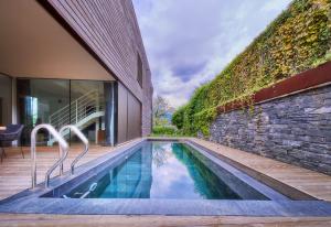 a swimming pool in the backyard of a house at Casa Sull'Albero in Malgrate