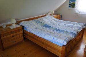 Un pat sau paturi într-o cameră la Na Rebri