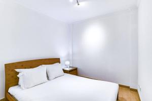 Una cama o camas en una habitación de Stylish central apartment with 2 bedrooms in Intendente
