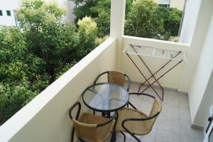 a table with chairs and a table cloth at Studio Apartments Marija in Makarska