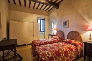 Ένα ή περισσότερα κρεβάτια σε δωμάτιο στο Holiday home Palazzo Bechelloni