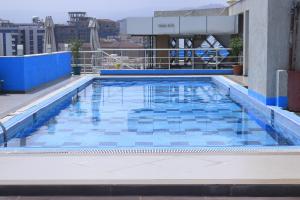 a swimming pool on the roof of a building at Momona Hotel in Addis Ababa