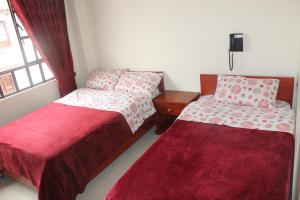 Postel nebo postele na pokoji v ubytování Hotel Vigua