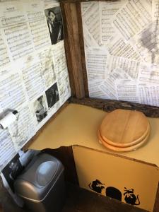 a box with a wooden toilet in a room at Yurt luxury + Bathhouse in Callington +69 photos