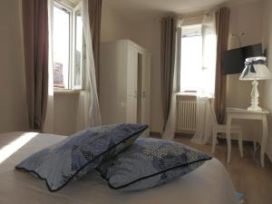 Postel nebo postele na pokoji v ubytování Santa Lucia B&B