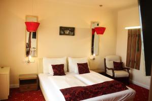 Posteľ alebo postele v izbe v ubytovaní Hotel Al Faro Lodge am See