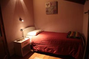 Posteľ alebo postele v izbe v ubytovaní B&B Vecchio Torchio di Bard