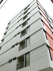 a tall building with balconies on the side of it at Tango Vibrant Living Hotel - SHA Extra Plus in Bangkok