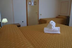 Letto o letti in una camera di Hotel Loreto