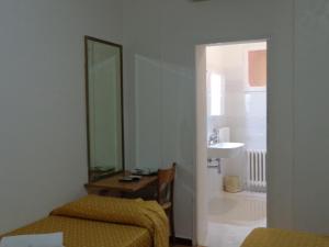 Letto o letti in una camera di Hotel Loreto
