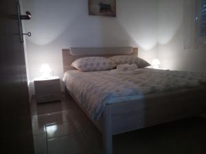 Postel nebo postele na pokoji v ubytování Apartman Pajo