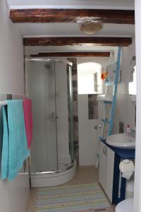 a bathroom with a shower and a sink at Mimi in Jadranovo +19 photos