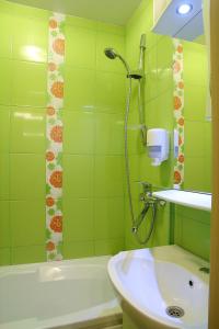 Ванна кімната в Ukrainian Hotel Service Apartments