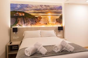 Postel nebo postele na pokoji v ubytování Atotxa Rooms