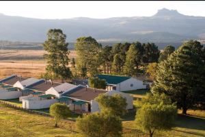 an aerial view of a farm with trees and buildings at Ezulwini Berg Resort in Ethels Drive