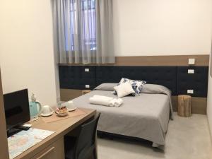 Postel nebo postele na pokoji v ubytování Al Pozzo di Luce Venezia Suites