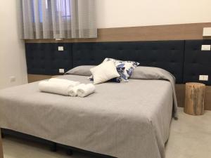 Postel nebo postele na pokoji v ubytování Al Pozzo di Luce Venezia Suites
