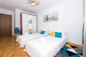 En eller flere senger på et rom på Apartment Dormir Split
