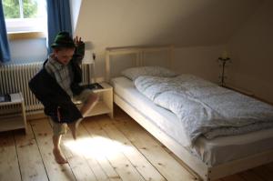 A bed or beds in a room at Rinntaverne
