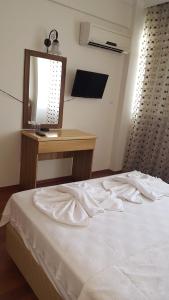Postel nebo postele na pokoji v ubytování Hotel Berlin