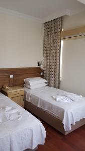 Postel nebo postele na pokoji v ubytování Hotel Berlin