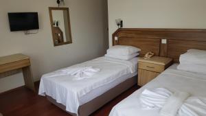 Postel nebo postele na pokoji v ubytování Hotel Berlin