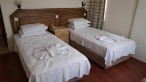Postel nebo postele na pokoji v ubytování Hotel Berlin