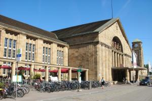 a building with a bunch of bikes parked in front of it at Royal Hotel - Urban Living in Basel