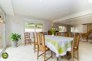 a dining room with a table and chairs at La Pastorale in Moirans