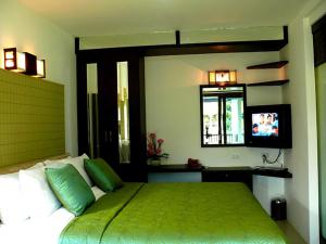 En eller flere senge i et værelse på Supsangdao Resort
