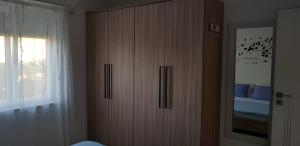 Postel nebo postele na pokoji v ubytování Apartmani Sanja
