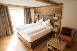 Łóżko lub łóżka w pokoju w obiekcie Olympia-Relax-Hotel Leonhard Stock