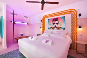 A bed or beds in a room at Paradiso Ibiza Art Hotel - Adults Only