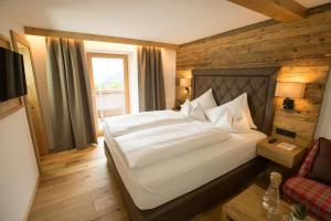 Łóżko lub łóżka w pokoju w obiekcie Olympia-Relax-Hotel Leonhard Stock
