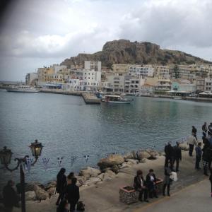 a group of people standing around a body of water at Kelly's studio SISAMOS in Karpathos