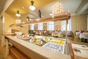 a buffet line with many plates of food on it at Hotel Luisa in Františkovy Lázně