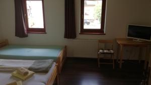 Posteľ alebo postele v izbe v ubytovaní Penzión Čergov