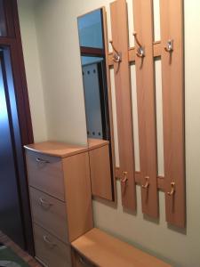 a dressing room with a mirror and drawers at Apartment Vila Jezero in Zlatibor