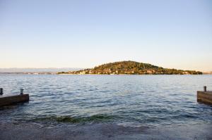 an island in the middle of a large body of water at Apartmani Blaslov in Kali